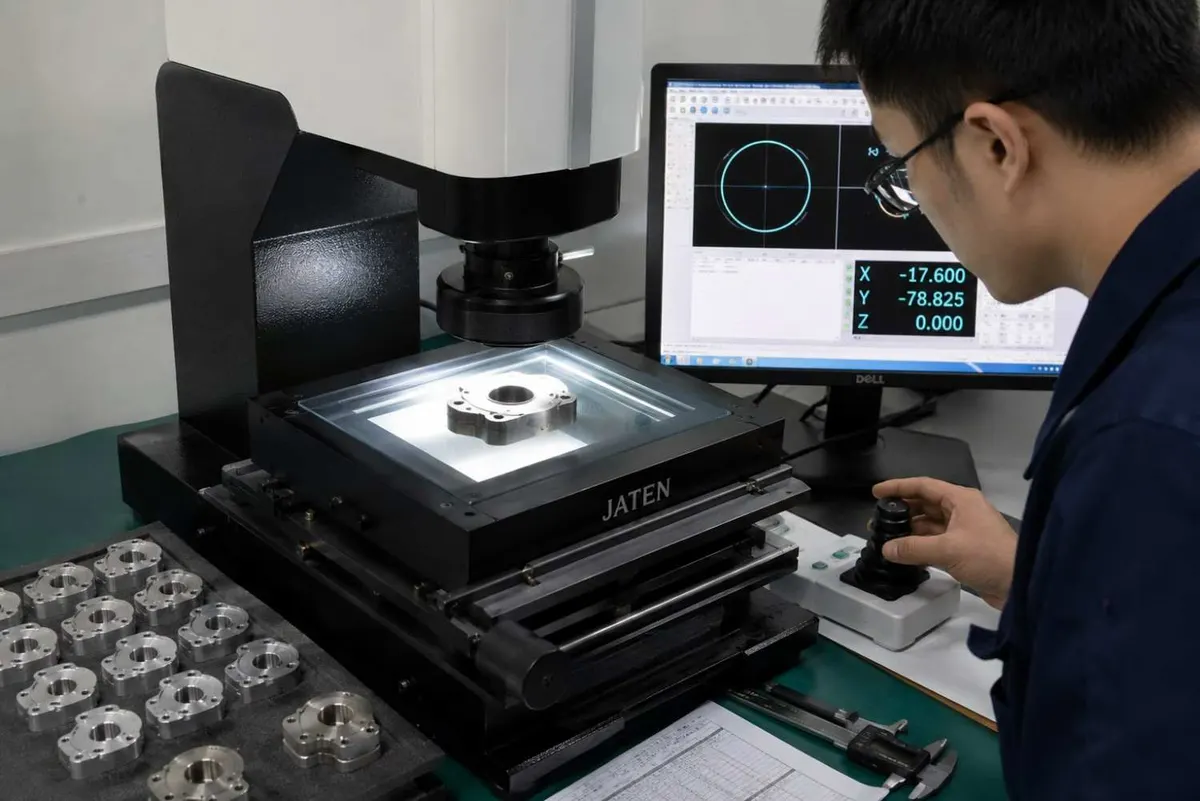 Inspector verifying part dimensions on optical measuring equipment