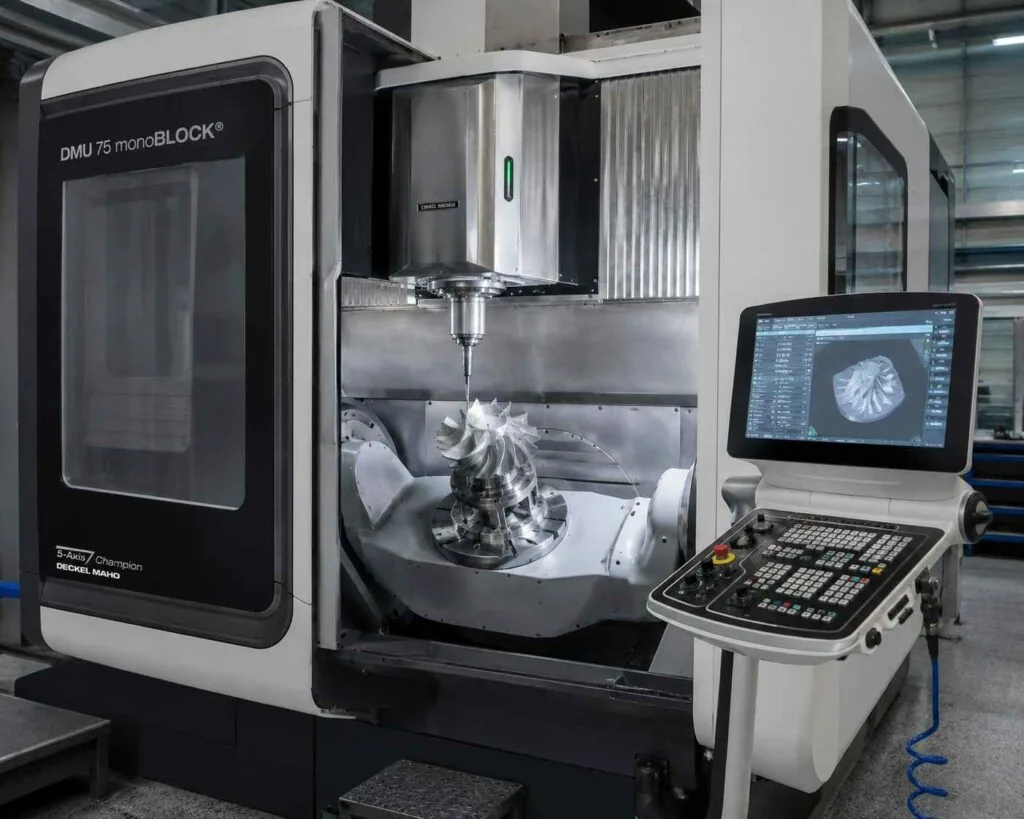 Five-axis machining center cutting a contoured aerospace component in a single setup