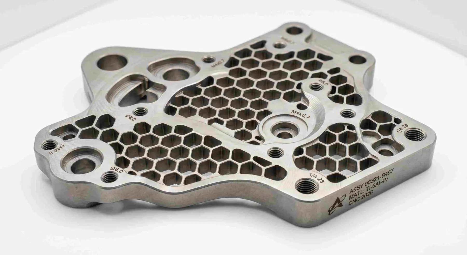 CNC machined metal plate with honeycomb pocketing and precision bores, produced at the MW+ facility in Shenzhen, China